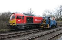 <I>Morning handover</I>. DBS 60017 has just arrived at Preston Dock with loaded bitumen tanks from Lindsey and meets RSR Sentinel <I>Enterprise</I> which will trip them to the terminal. The Class 60 will run round on the line in the foreground before picking up the empties from the centre road.  <br><br>[Mark Bartlett 27/11/2013]