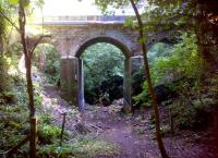<h4><a href='/locations/D/Devonshire_Tunnel'>Devonshire Tunnel</a></h4><p><small><a href='/companies/B/Bath_Branch_Somerset_and_Dorset_Railway'>Bath Branch (Somerset and Dorset Railway)</a></small></p><p>It looked easy on the OS map; but after joining the Two Tunnels Trail adjacent to this colourfully graffitied viaduct South of Devonshire Tunnel, I recommend that you find an easier access point! 43/85</p><p>07/07/2013<br><small><a href='/contributors/Ken_Strachan'>Ken Strachan</a></small></p>