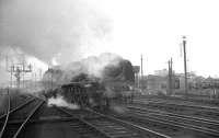Scene alongside Carlisle no 12 box on 7 March 1964 as Stanier Pacific no 46225 <I>Duchess of Gloucester</I>  moves off Upperby shed heading tender first towards Carlisle station to take over a southbound train.<br><br>[K A Gray 07/03/1964]