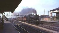 GWR modified Hall 4-6-0 no 6979 <I>Helperly Hall</I> takes an up fast freight through the centre road at Oxford in the summer of 1964.<br><br>[John Robin 27/08/1964]