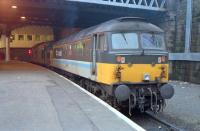 Until re-opening of stations on the Maryhill line, platform 1 at Queen Street was a bit of a purposeless backwater. Here it plays host to a class 47/7 and a 37 in January of 1989.<br><br>[Ewan Crawford /01/1989]