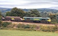 Freightliner 66529, running not far in front of the southbound <I>Fellsman</I>, approaches Armathwaite on 28th August 2013 with a loaded coal train which, according to the on-line Network Rail WTT, will be from Killoch Colliery to either Ratcliffe or Drax power station. <br><br>[Bill Jamieson 28/08/2013]