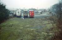 View west at Woodside and Burrelton in 1996. The signalbox still stood on the left with the station building and goods shed beyond the trailers. A house now stands in the area shown in the foreground.<br><br>[Ewan Crawford //1996]