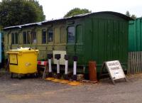<h4><a href='/locations/S/Sible_and_Castle_Hedingham'>Sible and Castle Hedingham</a></h4><p><small><a href='/companies/C/Colne_Valley_and_Halstead_Railway'>Colne Valley and Halstead Railway</a></small></p><p>Ignore the modern plasticky stuff and Disabled Parking sign. Just look at that corrugated iron roof, and the partly-refinished paintwork, and imagine the occupant drying his face on the curtains - like Dan Taylor in <I>The Titfield Thunderbolt</I>. 12/14</p><p>20/07/2013<br><small><a href='/contributors/Ken_Strachan'>Ken Strachan</a></small></p>