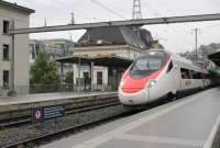 A SBB <I>New Pendolino</I> calls at Montreux on an Italy bound service from Geneva. The similarities of these ETR610 units to the Virgin Pendolinos are apparent but the generous loading gauge makes for a much bigger train.<br><br>[Mark Bartlett 10/09/2013]