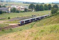 A Glasgow - Dundee train heads north through Blackford in the summer of 2006.<br><br>[John Furnevel 07/07/2006]