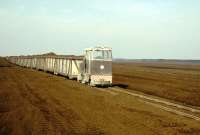 <I>The Boora Express</I> - scene on the Boora peat system, Co Offaly, in April 1996. [Editors note: The driver is thought to be in the bog... <I>sorry!</I>] <br><br>[Ian Dinmore /04/1996]