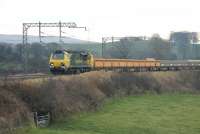 Freightliner 70002 takes an infrastructure train north at Bay Horse on 10 December.<br><br>[Mark Bartlett 10/12/2013]