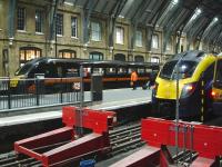 First Hull Trains 185111 at platform 6 and Arriva Grand Central 185112 at platform 8 await their departure times at Kings Cross on 4 December 2013 with the 18.50 for Hull and 19.18 for Sunderland respectively.<br><br>[David Pesterfield 04/12/2013]