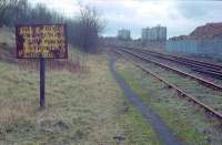 The sign read '<I>Exit from Ravenscraig by this route is strictly forbidden'</I>, although judging by the footpath this wasn't much of a deterrent. After lifting of Shields Colliery Junction the southern portion of the line from Ravenscraig was used to store redundant stock, although not on this occasion. Lanarkshire Steelworks formerly stood off to the right and '<I>The Craig</I>' is behind me. View looks south. From my Ravenscraig days.<br><br>[Ewan Crawford //1988]