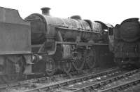 With 45699 <I>Galatea</I> having returned to mainline service in 2013, it seems appropriate to include this shot of it languishing in Barry scrapyard over 40 years ago. Purists may prefer the remnants of the BR lined green livery still visible, to the BR maroon which it presently carries, but otherwise it looks a sorry sight. The Merchant Navy Pacific on the right is 35009 <I>Shaw Savill</I>.<br><br>[Bill Jamieson 14/03/1970]