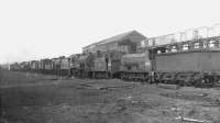 The stored locomotive line at Hurlford shed in the spring of 1962. Nearest the camera is <I>Jumbo</I> 57353, officially withdrawn from 67B in November the previous year.<br><br>[David Stewart 17/04/1962]