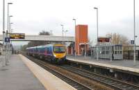 Although TPE's Scottish services now run via Parkside and Wigan other trains continue to run via Bolton. 185111 calls at Buckshaw on 13 December 2013 with a service to Barrow-in-Furness. Although the two platforms at this new but well used station are only 6 coach lengths they each have 17 lamp columns [See image 41590]. <br><br>[Mark Bartlett 13/12/2013]