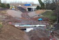 Progress at Sherriffhall on 15 December 2013, with the site remarkably tidy. The 'concrete box' through which the Borders Railway will run below the City Bypass is looking almost complete. Road traffic continues to use the temporary diversion in the background. <br><br>[John Furnevel 15/12/2013]