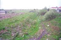 The site of Longriggend station in 1997, looking north east towards Slamannan. Little remained by this date and the site has been further infilled for housing development since the photograph was taken.<br><br>[Ewan Crawford 03/05/1997]