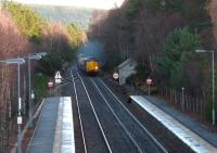 DRS 37605 and 37602 top and tail a northbound nuclear flask train approaching Carrbridge on 16 December.<br><br>[Gus Carnegie 16/12/2013]