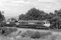 The Killoch to Drax/Ratcliffe power station coal train approaching Armathwaite on 17 July 2013 with Freightliner 66557 in charge. <br><br>[Bill Jamieson 17/07/2013]