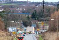 View south along the A7 on 18 December 2013 towards Hardengreen Roundabout, the centre of which is now occupied by a large bridge support. Newbattle Viaduct shows off its new blue safety fencing in the centre background, with Lady Victoria pit beyond. Gorebridge parish church stands on the horizon directly beyond the top of the crane jib.<br><br>[John Furnevel 18/12/2013]