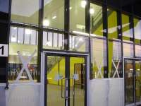 Views of the railside exit doors from the new station building at Wakefield Westgate that will give access onto platform 1, and, inside, of the staircase leading to the footbridge for platform 2; with the ticket barrier line seen on left of view. Final work is currently being carried out to have the new building made ready to open for business on Sunday 22 December.  <br><br>[David Pesterfield 18/12/2013]