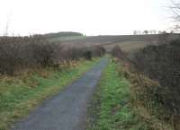 Looking across Knitsley embankment in the direction of Lanchester in November 2012. This huge colliery spoil and spent ballast construction replaced a 700' long wooden trestle viaduct around the time of WWI. The Consett to Durham line finally closed completely around 1964 and is now one of a number of County Durham cycleways that follow old railway lines. <br><br>[Mark Bartlett 27/11/2012]