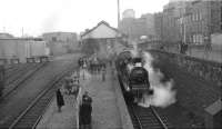 With interested observers hanging onto the iron railings on Lindsay Road, 57550 prepares to depart from Leith North on 3 February 1962 with the SLS <I>Peebles Railtour</I>. (The tour had started from Princes Street and would terminate at Waverley.) Note the traffic on Lindsay Road this particular Saturday afternoon - consisting of a bus! [See image 1082]<br><br>[David Stewart 03/02/1962]