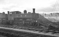 With GWR lettering proudly displayed, 0-6-0PT 7428 stands at the end of a siding by Oswestry shed in April 1963.<br><br>[K A Gray 02/04/1963]