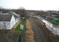 Looking south past the former Millerhill station along the trackbed of the old Waverley route on 20 December 2013. The new route to Tweedbank will leave the original alignment at the north end of Millerhill yard and run through Shawfair, to the west of here. The redundant section of the trackbed is now crossed by an access road used by construction traffic in connection with the new recycling facility to be built on the west side of the yard. <br><br>[John Furnevel 20/12/2013]