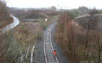 A STOP banner augments the pair of wooden sleepers chained across the rails near the site of Millerhill South Junction in December 2013. The line ahead gave access to Millerhill Yard east as well as providing a link to the ECML via Millerhill East and Monktonhall Junctions. [See image 35723] <br><br>[John Furnevel 20/12/2013]