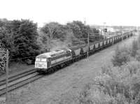 EWS 56117 heading north out of Millerhill yard with a coal train in the summer of 1998. This locomotive was withdrawn in 2010 and is one of a number of the class subsequently obtained by Hungarian freight operator Floyd for use in Europe.<br><br>[John Furnevel 30/06/1998]