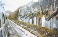 Old clay chutes near Bugle, photographed from a window of <I>The Royal Duchy</I> DMU Railtour in April 1997, during a visit to some of the remote clay branches in Cornwall. [See image 36516]<br><br>[Ian Dinmore 30/04/1997]