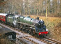 BR Standard class 5 no 73096 running as long lost sister 73052 and sporting a <I>Pines Express</I> headboard at Crowcombe Station on 10 March 1996 during an S&D weekend.<br><br>[Peter Todd 10/03/1996]