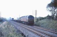 Brush type 4 no D1842  heading north with a lightly loaded <I>Motorail</I> service in the summer of 1965. The train is approaching Cumbernauld near the site of the station that would be opened 24 years later as Greenfaulds. [Ref Query 4151]<br><br>[G W Robin 31/08/1965]