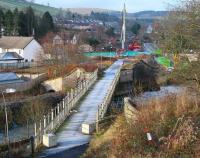 <I>Rise of the machines II</I>. Construction teams and equipment approaching Galashiels on 26 December 2013 on the north side of Wheatlands Road, which will be spanned by a new railway bridge. View from Plumtreehall Brae looking north across the Gala Water to the site of Kilnknowe Junction. [See image 35869]  <br><br>[John Furnevel 26/12/2013]