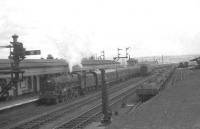 A down train runs non-stop through Carstairs station on 4 August 1962. Carnforth based Jubilee 45633 <I>Aden</I> is in charge of a summer Saturday service returning north from Blackpool.<br><br>[John Robin 04/08/1962]