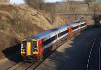 A pair of East Midlands 158s, with 158854 leading 158846, approaching Chinley North Junction on 25 March 2012. The train is on its way from Liverpool to Nottingham.<br><br>[John McIntyre 25/03/2012]