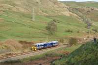 A Blackpool to York service drifts downhill at Copy Pit on 11 April 2012.<br><br>[John McIntyre 11/04/2012]