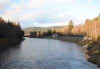 The Deeside Line immediately west of Cambus o' May, delineated by the retaining wall and fence on the right. Looking west to Ballater, the trackbed no more than 5m from the river. The house at mid-distance is called <I>Cutaway Cottage</I>, a diagonal slice having been taken from its gable end to give clearance to passing trains. <br><br>[Brian Taylor 26/12/2013]