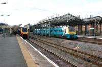 Platform scene at Chester on 21 March 2012. On the left a Virgin Voyager has just arrived from Euston, while ATW 175110 prepares to depart eastwards for Manchester Piccadilly.<br><br>[John McIntyre 21/03/2012]