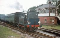 Scene on the Bluebell Railway in July 1971 with a train passing Horsted Keynes South box behind 0-6-0T no 323.<br><br>[John Thorn /07/1971]