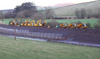 Scene on the Waverley route just north of Bowland station site on 26 December 2013, with various equipment used on the Borders Railway project parked out of use over the holiday period.   <br><br>[John Furnevel 26/12/2013]