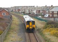 Heading for Squires Gate though the Blackpool suburbs on 13 November, embellished Sprinter 150215 is seen from the Harrowside road bridge. Northern Rail recently announced that it had raised over 10,000 for men's health charities during <I>Movember</I>.<br><br>[Mark Bartlett 13/11/2013]