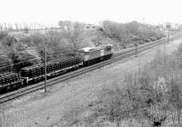 A Class 56 in <I>Loadhaul</I> livery brings a tracklifting train into Millerhill yard from the north in November 1997.<br><br>[John Furnevel 03/11/1997]