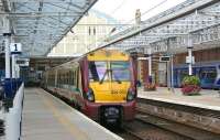 334003 waits alongside platform 1 at Helensburgh Central for its next turn on 23 September 2012.<br><br>[John McIntyre 23/09/2012]