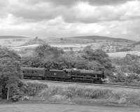 On a hot June day, the exhaust from 46115 <I>Scots Guardsman</I> is little more than a faint haze as it approaches Armathwaite<br>
with the southbound <I>Fellsman</I> returning to Lancaster.<br><br>[Bill Jamieson 26/06/2013]