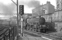 Jubilee 45688 <I>Polyphemus</I> runs through Eglinton Street, shortly after leaving Glasgow Central with the 6.58pm to Penzance on Glasgow Fair Friday 13 July 1962.<br><br>[John Robin 13/07/1962]