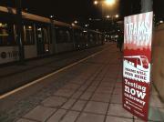 Notice at Haymarket on the evening of 8 January 2014 - with an Edinburgh tram parked at the tram stop.<br><br>[John Yellowlees 08/01/2014]