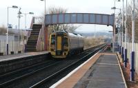 DMU 158738 leaves a mastless Mount Vernon station on 8th January 2014 for Carmyle on its way to Glasgow Central high level. Electrification of this line is due to be completed in time for the Commonwealth Games in summer 2014<br><br>[Colin McDonald 08/01/2014]