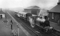 The BLS/SLS <I>Scottish Rambler</I>, comprising CR 123 and the two preserved Caledonian coaches, stands at Crosshouse station on the north western outskirts of Kilmarnock on 24 April 1962. The special had been scheduled to travel from Glasgow Central to Kilmarnock by way of Whitecraigs, but on the day was routed via Dalry due to a signalling error. <br><br>[David Stewart 20/04/1962]