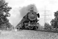 In September 1974 the Rheine - Emden line was single track over the River Ems (possibly due to wartime damage to the bridge) resulting in a significant bottleneck on a line which was very busy with freight. Here 3 cylinder 2-10-0 No. 044 569 on a southbound train of bogie hoppers approaches Elbergen, where double track resumed.<br><br>[Bill Jamieson 06/09/1974]