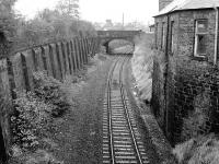 View west from Inglis Street, Dunfermline, on 9 November 1986 [see image 45948] with track still in place. The cutting was soon filled in with car parks and roads, completing the transformation.<br><br>[Bill Roberton 09/11/1986]